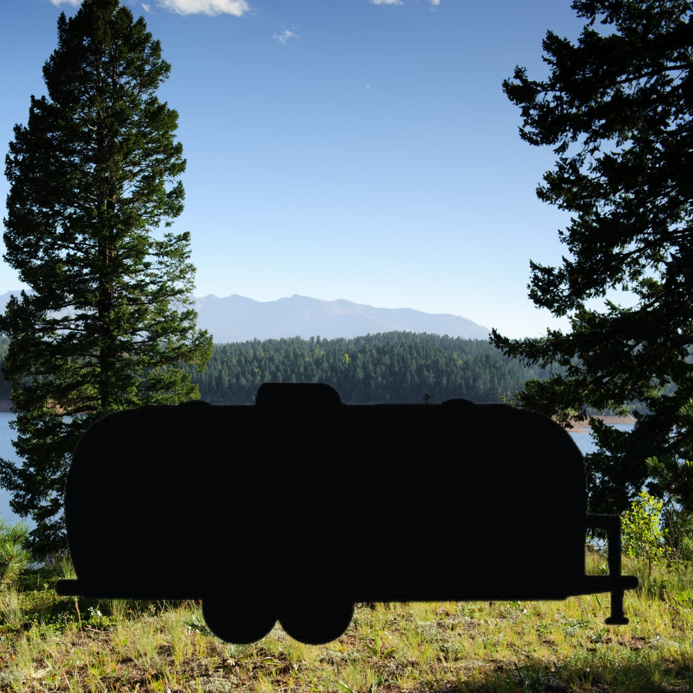 Precut glass shape of AirStream Trailer by lake.