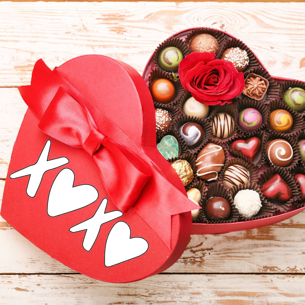 Precut glass shape of XOXO on a chocolate box.