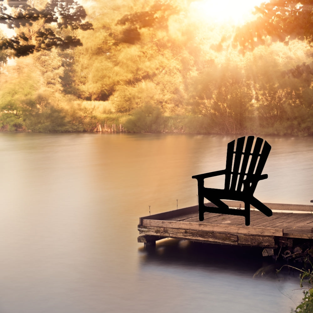 Precut glass shape of an adirondak chair on a lake.