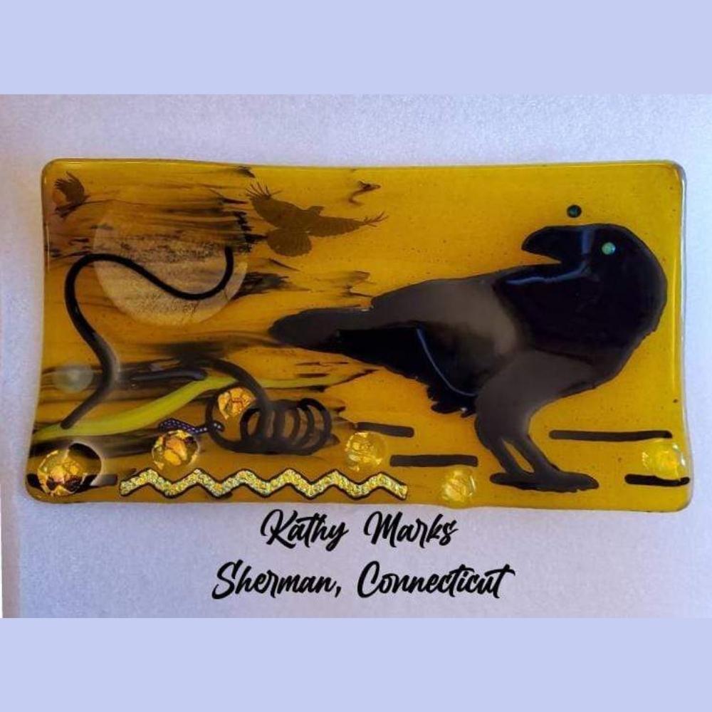 Precut glass shape of a raven in an art piece by Kathy Marks.