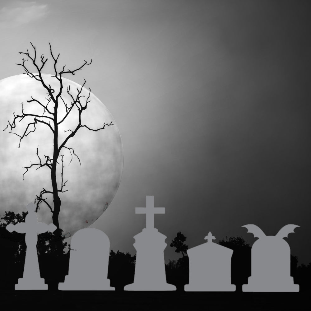 Precut glass shape of tomb stones in grey under a full moon.