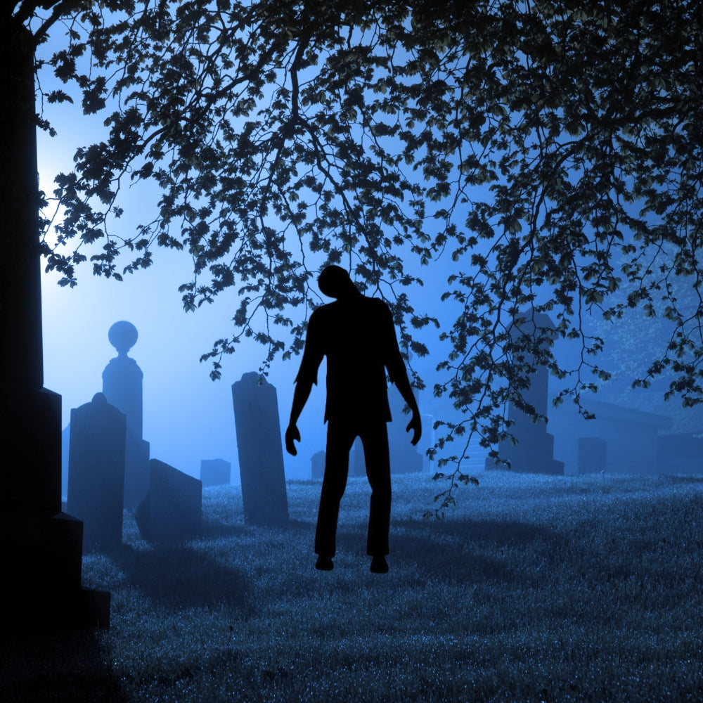 Precut glass shape of a zombie in a graveyard