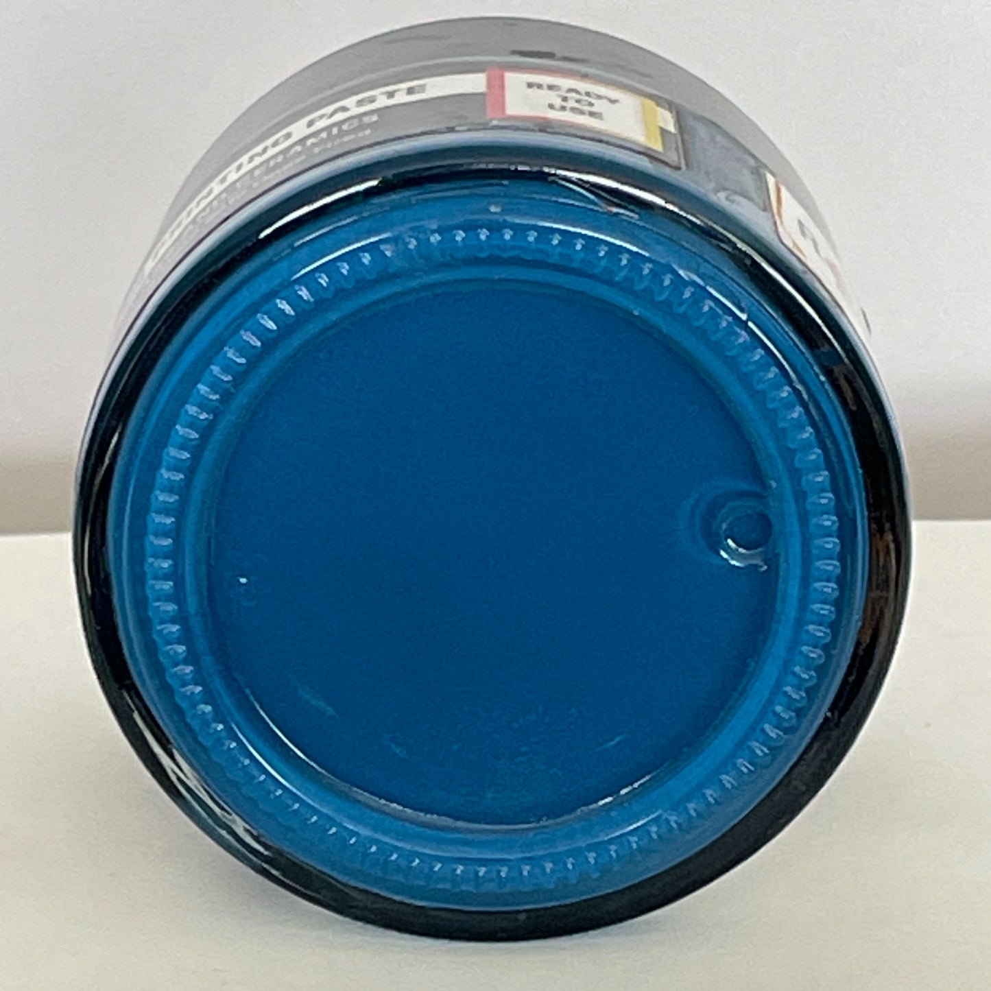 Jar of Vivid Turquoise screen printing paste showcasing its vibrant hue and smooth consistency